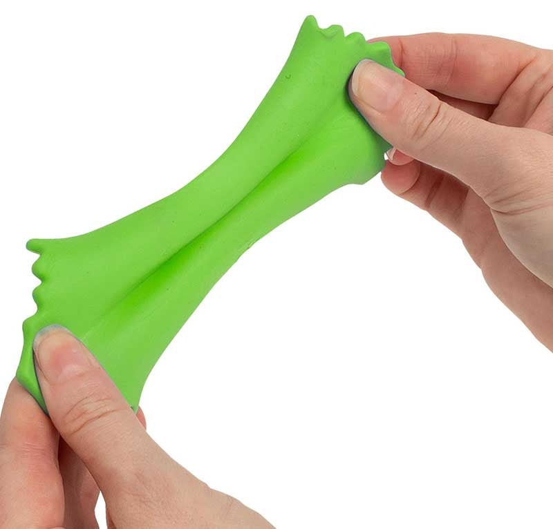 Two hands stretching green Scrunchems Stretchy Squeezy Pasta Shape showing flexible stretchy texture.