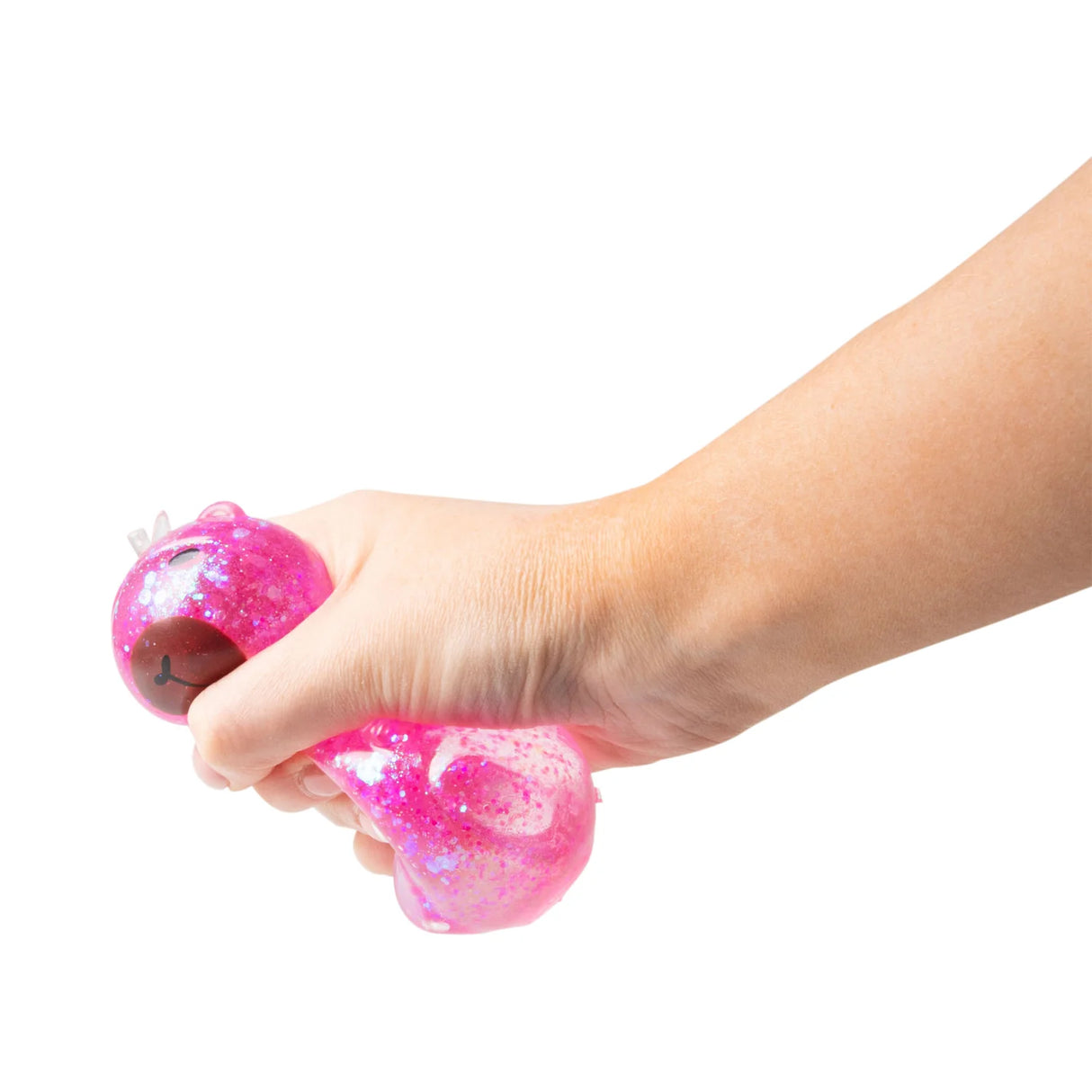 Hand squeezing and deforming a hot pink glitter Scrunchems Sugar Capybara squishy