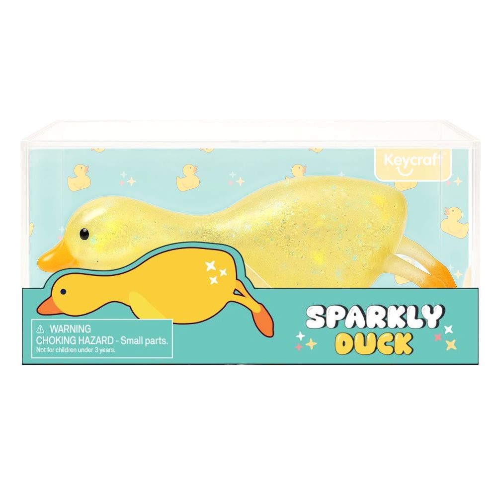 Yellow glitter squishy duck toy shown in clear Keycraft branded packaging with duck-print background