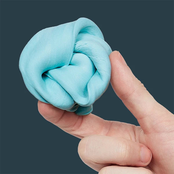 Hand squeezing soft lagoon blue sensory putty ball, showing stretchy silicone texture