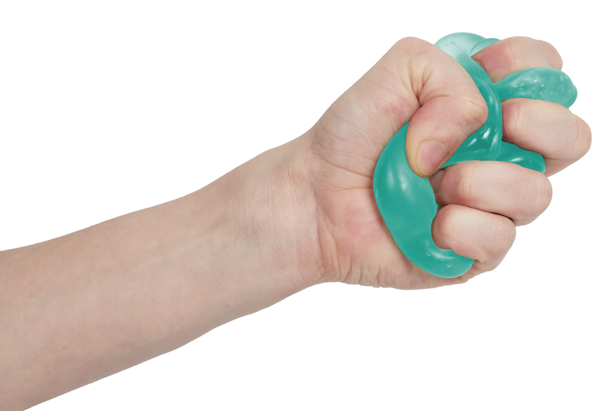 Fist squeezing a mint green Speks Gump tree squishy into a twist, stretchy sensory toy
