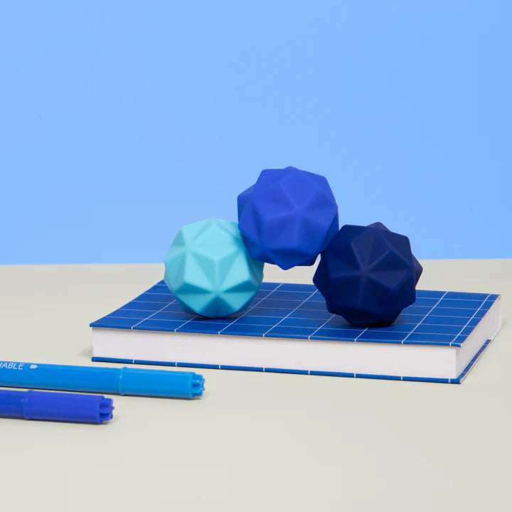 Speks Odds Blue Peaks sensory fidget magnets on notebook, desk toy