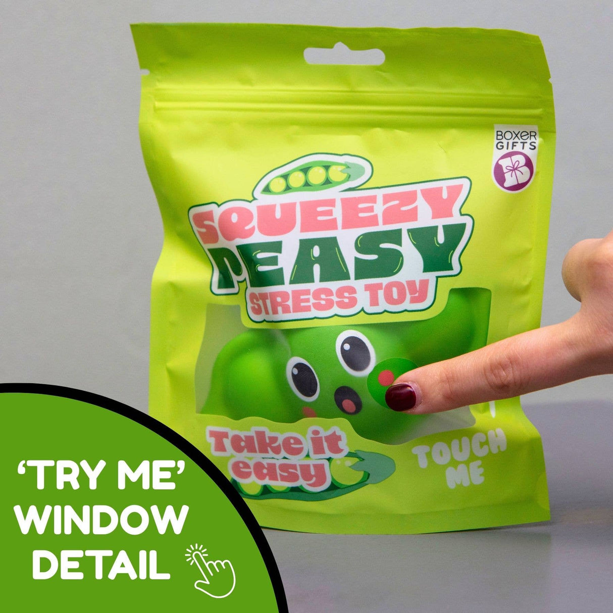 Finger pressing through the try-me window on the front of the Squeezy Peasy packaging bag