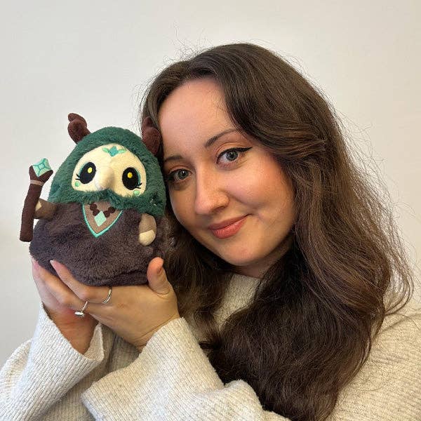 Squishable Plague Doctor Forest Queen collectible plush held up close by smiling woman