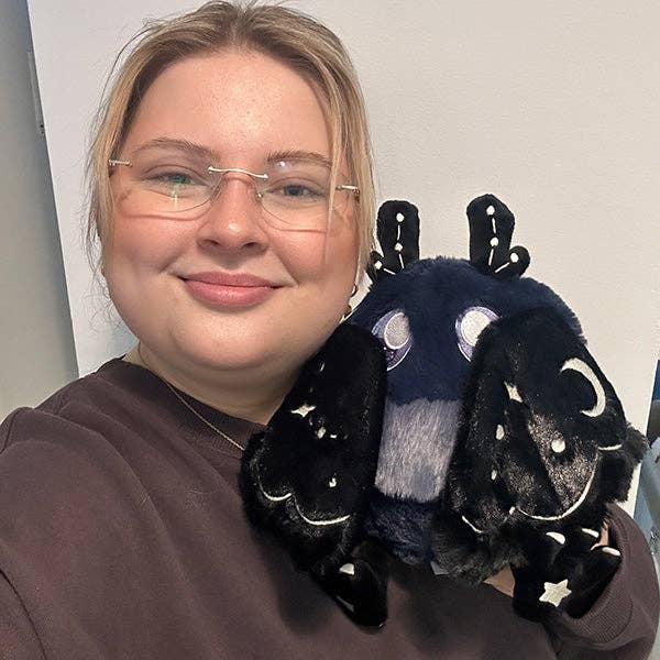 Squishable Mini Midnight Mothman plush lifestyle shot size reference