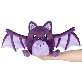 Squishable Mini Spooky Bat purple plush wings open held in hand