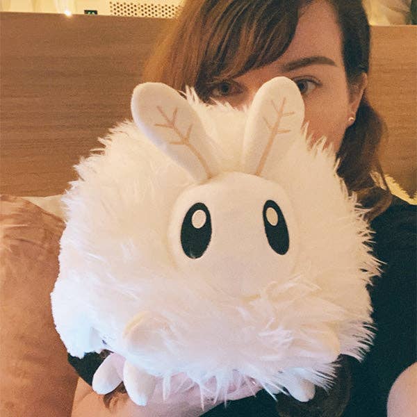 Squishable Poodle Moth large white plush held by person size reference
