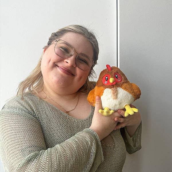 Squishable Snugglemi Snackers Hen mini plush held by person size reference
