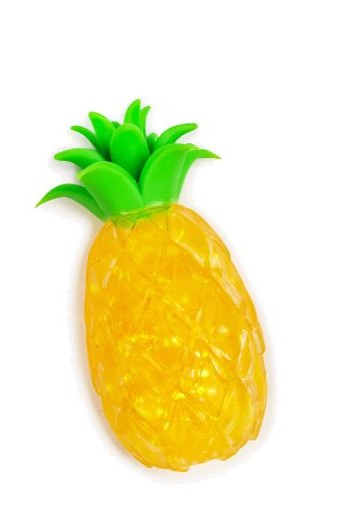 Close-up of yellow glitter gel pineapple squishy fidget toy with bright green leaf crown