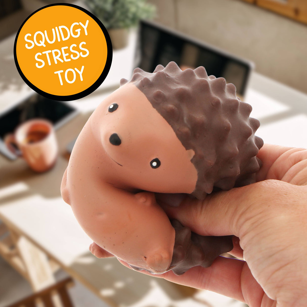 Close-up of the Stress Hog kawaii hedgehog squishy being held in one hand indoors