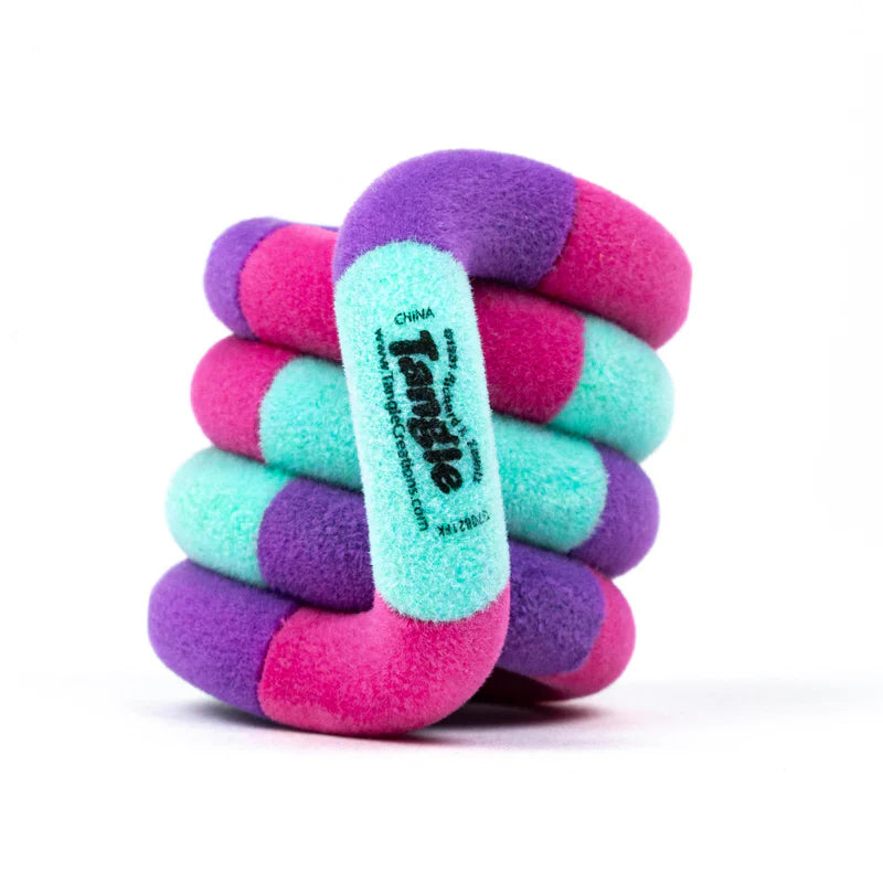 Purple, pink, and teal Tangle Jr. Fuzzy fidget toy coiled into its resting spiral shape showing soft velvety texture