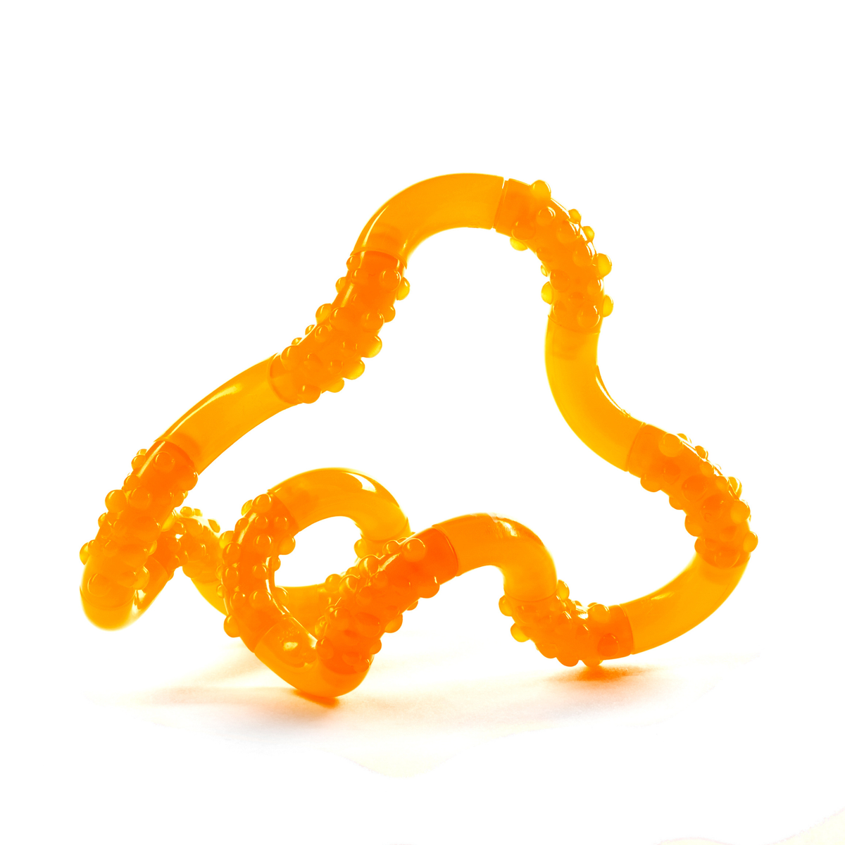 Orange glow-in-the-dark Tangle Jr. bumpy twisty fidget toy twisted into a wavy shape