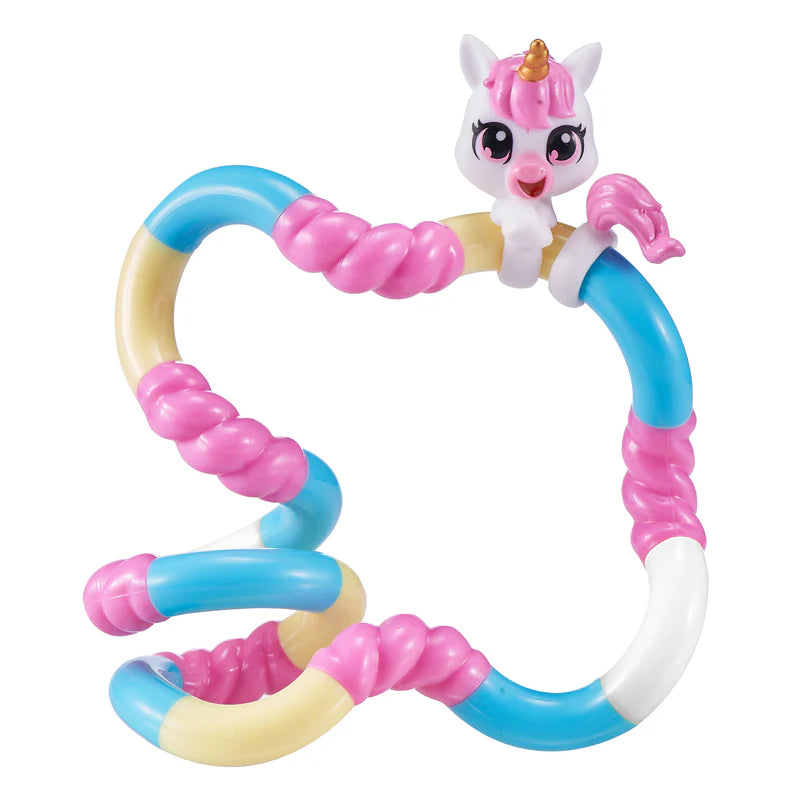 White unicorn Tangle Jr. Pet fidget toy with pink and blue segments laid out in a freeform shape