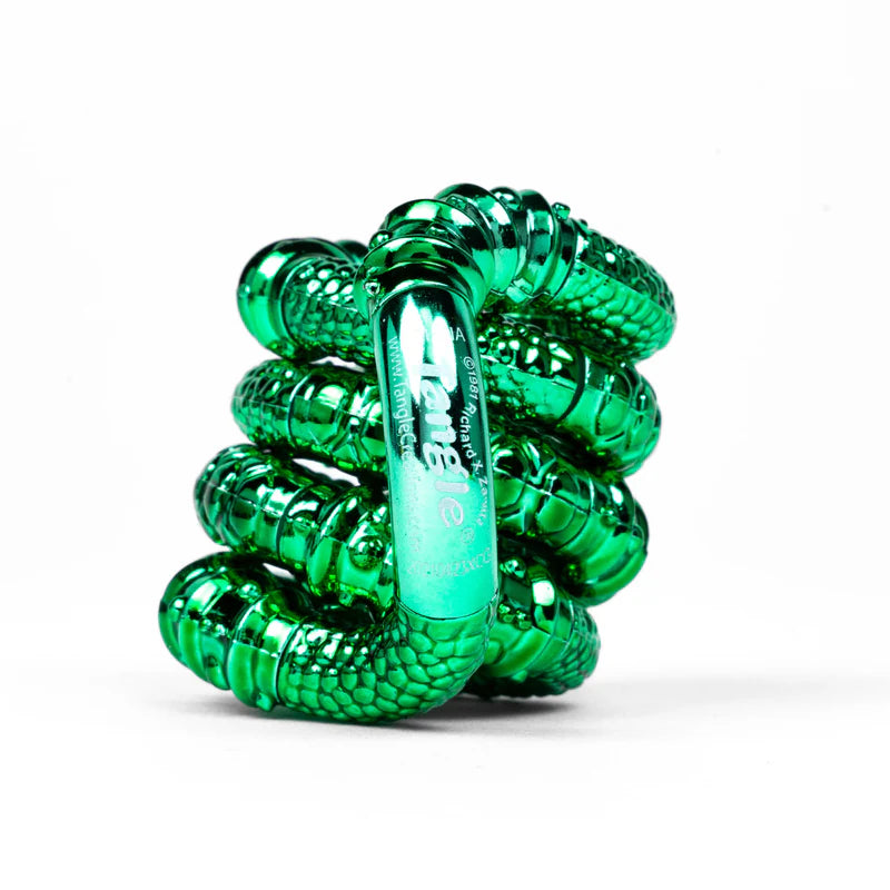 Green textured metallic Tangle Jr. fidget toy coiled showing ridged scalloped chrome surface detail