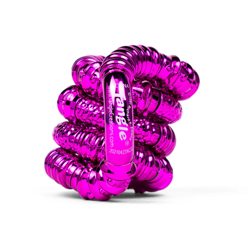 Pink textured metallic Tangle Jr. fidget toy coiled showing high-shine ridged chrome finish