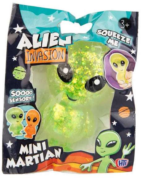 Green glitter Mini Martian squeeze toy in Alien Invasion space-themed polybag packaging
