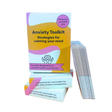 Three Anxiety Toolkit card deck boxes stacked on a white background with card deck fanned out to the side