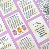Flatlay of multiple Anxiety Toolkit cards showing content including the 4-7-8 breathing technique, affirmation cards, anxiety cycle explanation and butterfly hug grounding technique