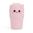 Pastel pink Big Squij Tumbler squishy toy with a smiling face, standing alone