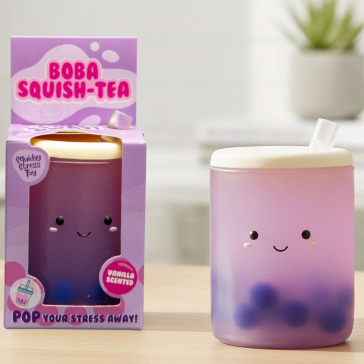 Kawaii vanilla scented boba tea squishy stress toy next to its purple Boba Squish-Tea gift box