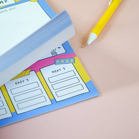 Close-up of brain dump notepad task section, colourful washi tape detail
