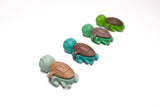 Calm Buddi Turtle fidget toys in diagonal line, mint teal and green Nature colourway