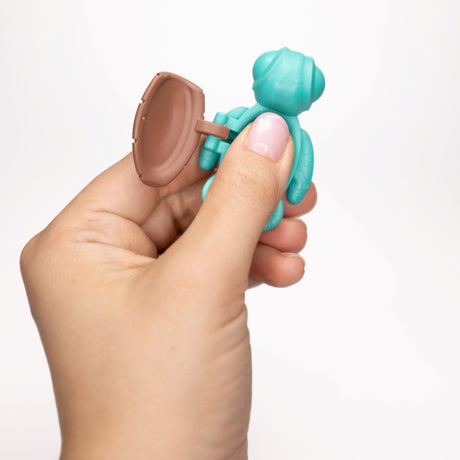 Teal Calm Buddi Turtle shell open in hand, sensory fidget anxiety toy