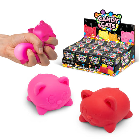 Candy Cats display box with pink and red squishies in front and hand squeezing a pink one