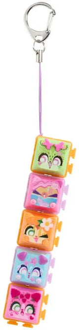 Five Clickeez Series 2 collectible characters stacked and hanging on a clip