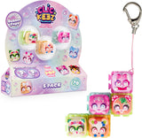 A 5-pack of Clickeez Clickable Collectibles by Clickeez, featuring bubble pop toys in a display box with four loose collectibles attached to a pink keychain clip on a white background.