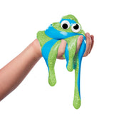 Green and blue Cra-Z-Compounds sensory slime with googly eyes dripping from hand