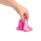 Hand stretching pink glitter Cra-Z-Compounds sensory slime compound