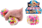 Hand squeezing multicolour Crackling Pearls ASMR bead stress ball alongside plain product shot and display box