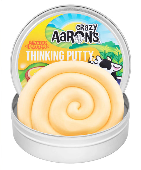 Crazy Aaron's Better Butter Thinking Putty open tin showing creamy yellow putty coiled inside with farm-themed lid artwork