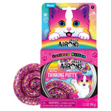 Crazy Aaron's Curious Kitten Thinking Putty tin showing sparkly pink and purple glitter putty with rainbow kitten-themed packaging