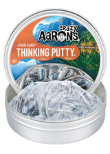 Crazy Aaron's Liquid Glass Thinking Putty open tin showing clear mirror-like reflective putty with nature-themed lid artwork