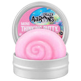 Pink thinking putty in a container with 'Crazy Aaron's' branding on a white background