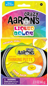 Crazy Aaron's Over Easy Liquid Glass Thinking Putty tin packaging showing yellow glossy putty