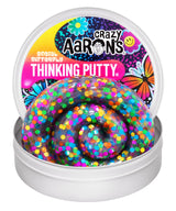 Crazy Aaron's Social Butterfly Thinking Putty open tin showing clear putty packed with bold multicoloured round confetti dots and butterfly-themed lid artwork
