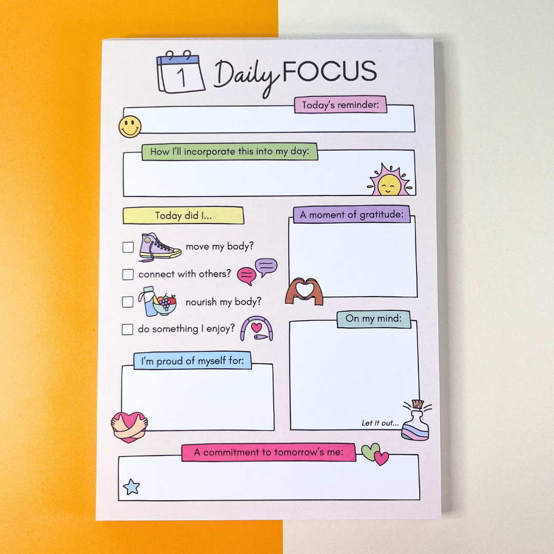 Daily Focus daily self-care notepad full view, pastel, orange and white background