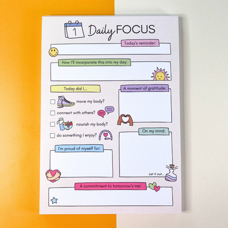 Daily Focus daily self-care notepad full view, pastel, orange and white background