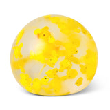 Close-up of the clear duck squish ball showing yellow polymer clay duck slices and resin duck floating inside