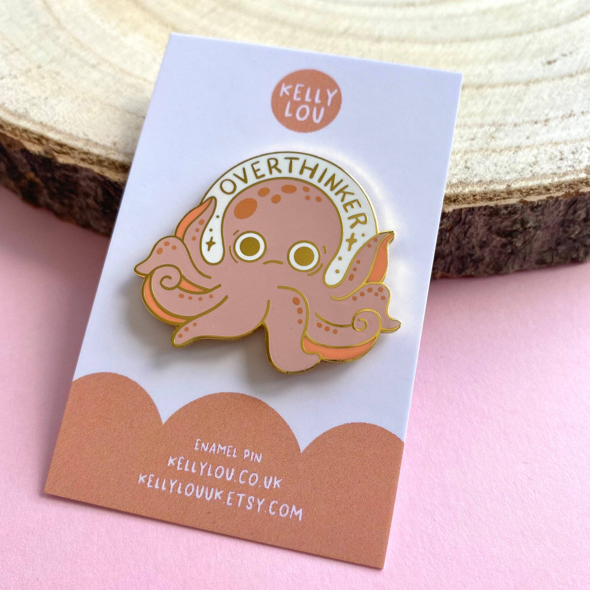 Enamel pin of an octopus with 'Overthinker' on a Kelly Lou branded card.