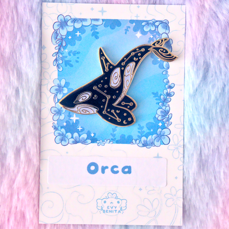 Evy Benita Arctic Nova Orca enamel pin on floral backing card, gold plating