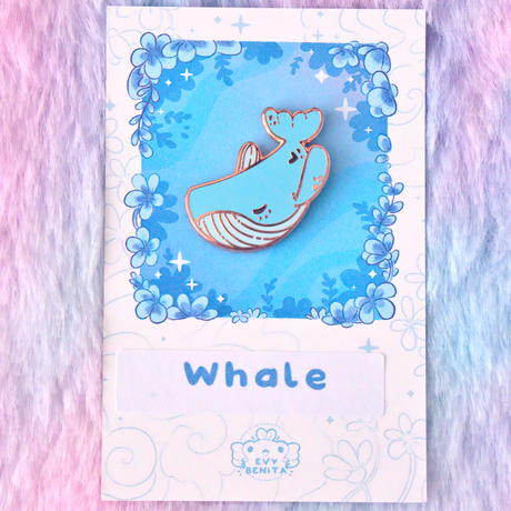 Evy Benita Lullaby Sky Whale enamel pin on floral backing card, pink background