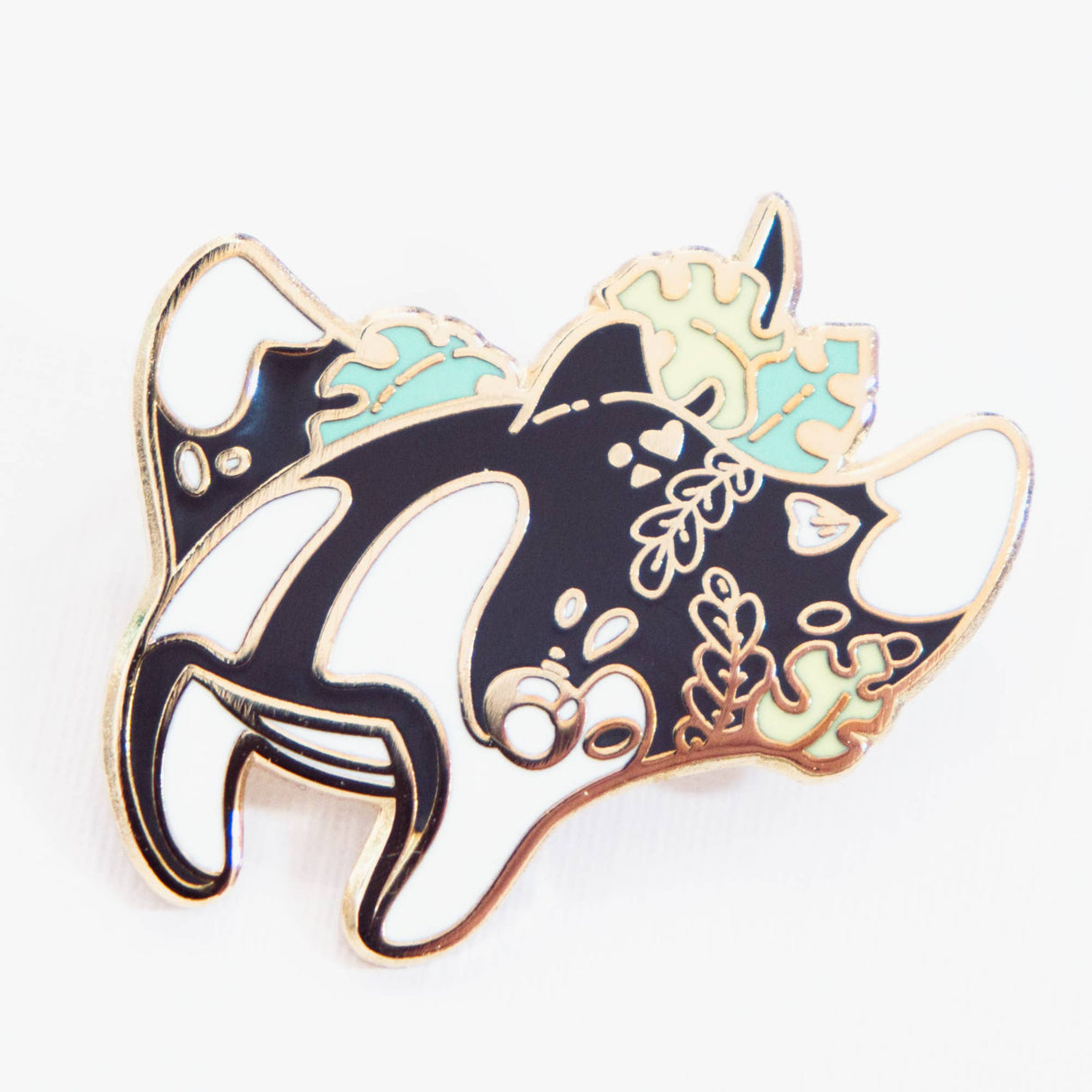 Evy Benita Oceanic Manta Ray enamel pin angled, black white teal floral detail