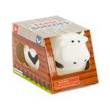 Farm Squeezies black and white cow squishy sensory toy in barn-themed box packaging, ages 3 plus