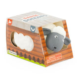 Farm Squeezies white and grey sheep squishy sensory toy in barn-themed box packaging, ages 3 plus