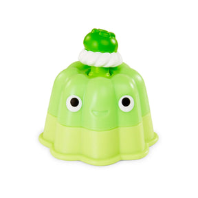 Lime green jelly pudding fidget toy with whipped cream topping and a cute face