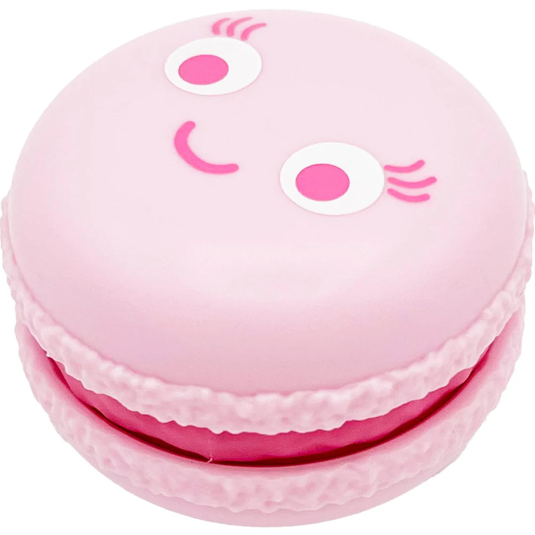 Pink kawaii macaron fidget toy with a winking smiling face design
